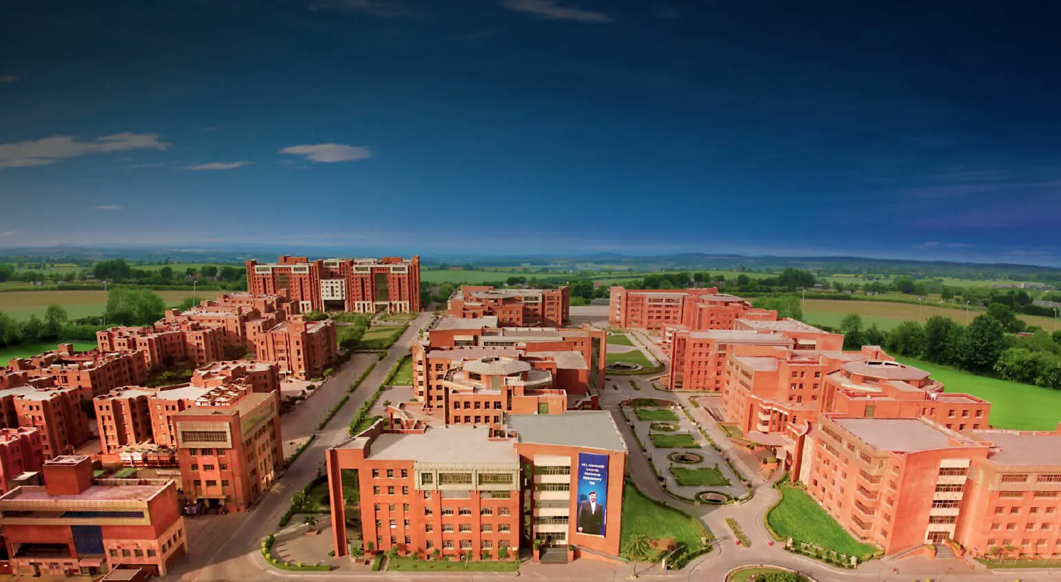 Aerial view of the red-brick Amity University campus, Noida