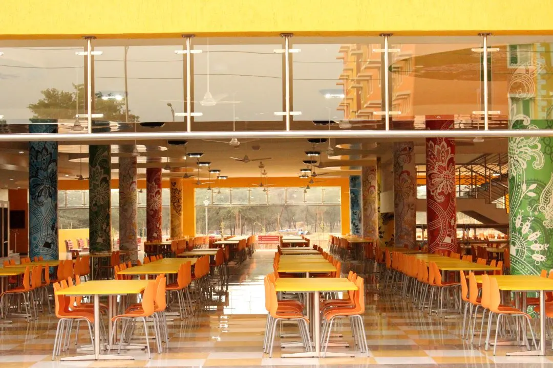 Dining hall with painted pillars at Manipal University Jaipur